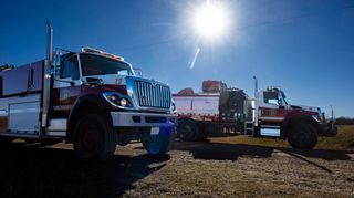 Fire crews work the burn area on CFB Wainwright south of the town Wainwright Alta., on Sunday, Oct. 18, 2026. Four people have been killed and numerous others injured.