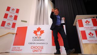 Forever Canadian founder Thomas Lukaszuk plays a cowbell while waiting for results at the pro Canada watch party in Edmonton, Monday, Oct. 19, 2026. THE CANADIAN PRESS/James Maclennan