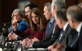 FILE: Alberta Premier Danielle Smith adjusts her microphone as she prepares to speak during a news conference following the First Ministers Meeting in Ottawa.