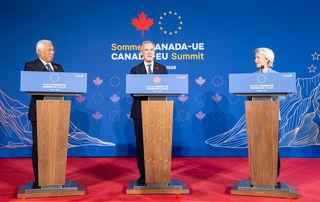 Prime Minister Mark Carney, centre, flanked by European Council President Antonio Costa, left, and Commission President Ursula von der Leyen speaks to the media during the closing press conference during the EU-Canada summit in Montreal on Friday, Oct. 30, 2026.