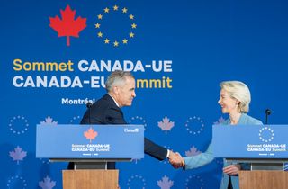 Prime Minister Mark Carney shakes hands with European Commission President Ursula von der Leyen following their closing press conference during the EU-Canada summit in Montreal on Friday, Oct. 30, 2026.