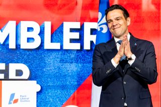 Quebec Liberal Party leader Charles Milliard celebrates on stage, on election day in North Hatley, Que., on Monday, Oct. 5, 2026.