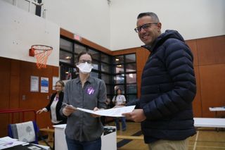 Vancouver Liberals mayoral candidate Kareem Allam casts a vote in the municipal election.