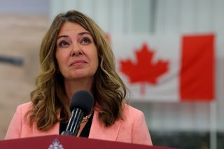 FILE: Alberta Premier Danielle Smith listens to a question during a press conference at the Canadian Forces Base in Edmonton.