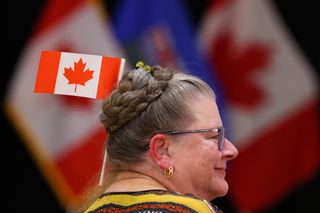 A supporter waits for results at the pro Canada watch party in Edmonton, Monday, Oct. 19, 2026.