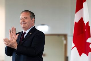 Former Alberta premier Jason Kenney claps at an Edmonton Chamber luncheon, in Edmonton, on Tuesday, Oct. 13, 2026.