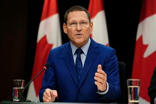NDP Leader Avi Lewis speaks during a news conference against Bill C-39 in the National Press Theatre in Ottawa, on Thursday, Oct. 8, 2026.