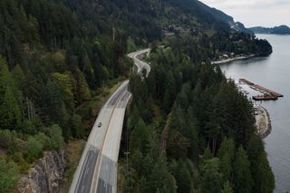 Motorists travel on the Sea-to-Sky highway between Horseshoe Bay and Lions Bay, B.C., on Friday, April 23, 2021.
