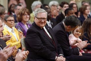Former Liberal cabinet minister Lloyd Axworthy, centre, is pictured at Rideau Hall in Ottawa on May 24, 2017.