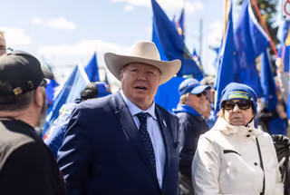 Jeffrey Rath shows his support for Mitch Sylvestre as he submits signatures for a separation referendum to Elections Alberta in Edmonton, on Monday, May 4, 2026. THE CANADIAN PRESS/Jason Franson