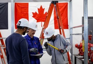 Trainee pipe fitters learn their trade at a union facility in Calgary, Friday, May 15, 2026.