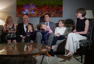 B.C. NDP Leader David Eby, his wife Cailey Lynch, right, children Iva, 7, Gwen, 2, and Ezra, 12, and Lynch's parents Kay Armstrong, left, and Alex Lynch, second left, sit together while waiting for results to begin coming in on election night, in Vancouver, on Saturday, Oct. 24, 2026. THE CANADIAN PRESS/Darryl Dyck
