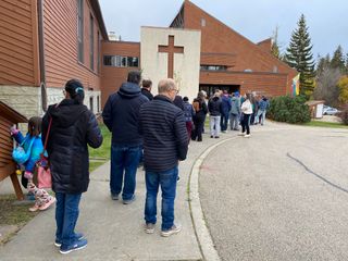 People were queued to vote in Alberta's referendum at the St. Albert United Church before the polling station opened the morning of Oct. 19, 2026.